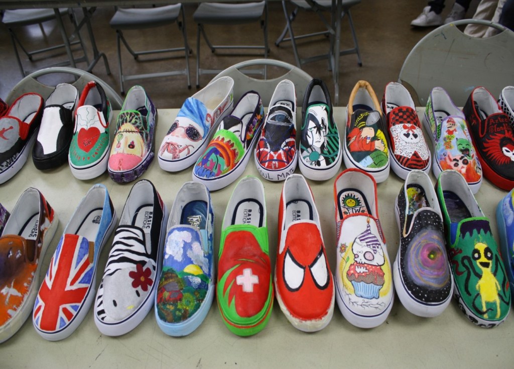 Sneakers created by Jefferson Arts Academy students during a custom sneaker design workshop with artist Rachel Yoakum.